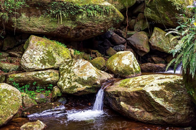 Small stream and waterfall among the rocks on Ilhabela Island off the coast of Sao Paulo, Ilhabela, Sao Paulo, Brazil
