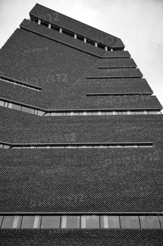 Façade of the Tate Gallery of Modern Art, former combined heat and power plant, Bankside, Southwark, black and white, London, England, Great Britain