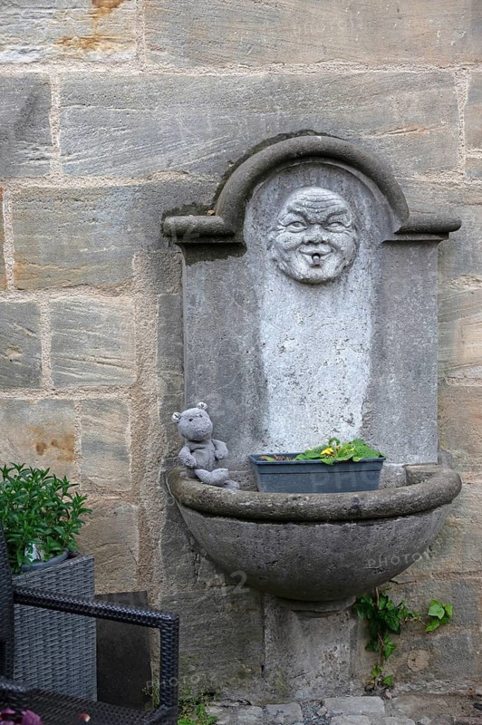 Old fountain at a church, Bamberg, Upper Franconia, Bavaria, Germany