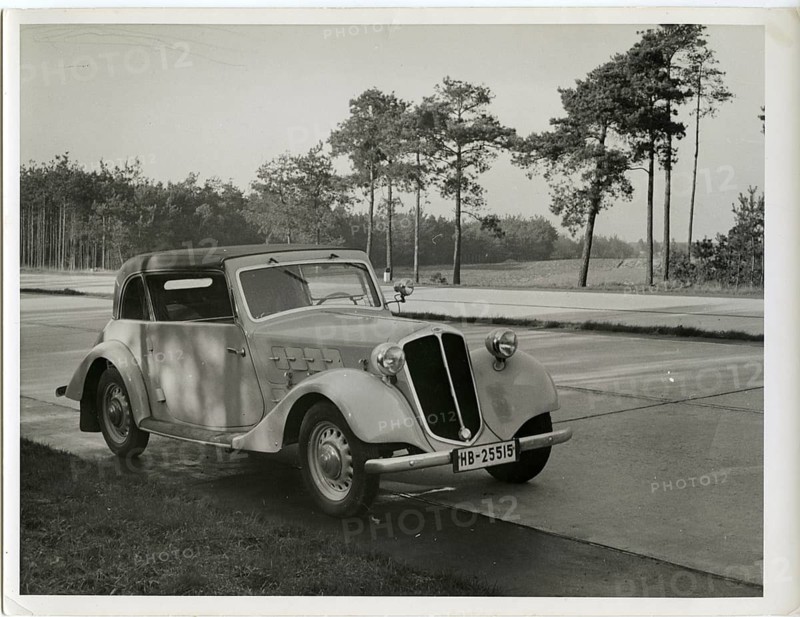 Vintage car, coupé, commercial photo. Reichs-Autobahn, A vintage car parks on the side of the road with a view of a wooded horizon and open road, Karl Theodor Gremmler