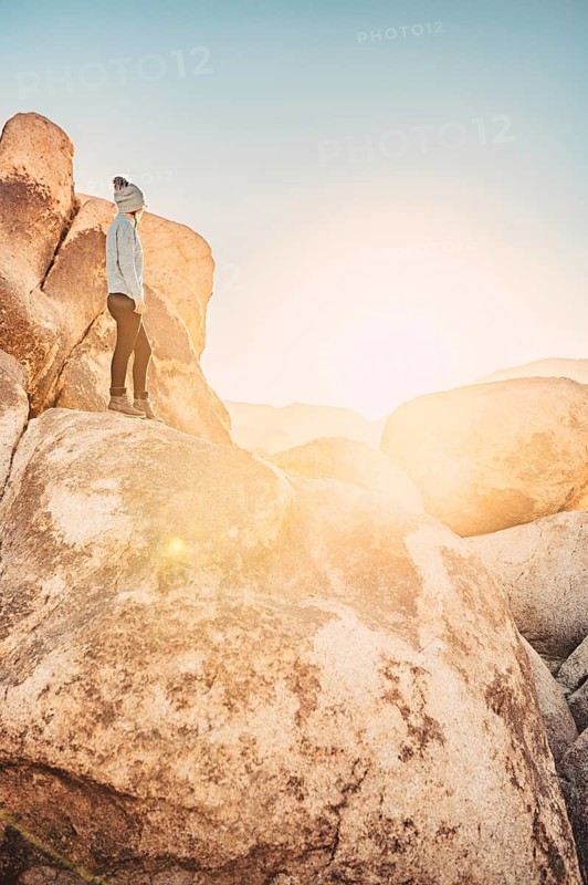 Woman hiking at sunrise in Joshua Tree National Park