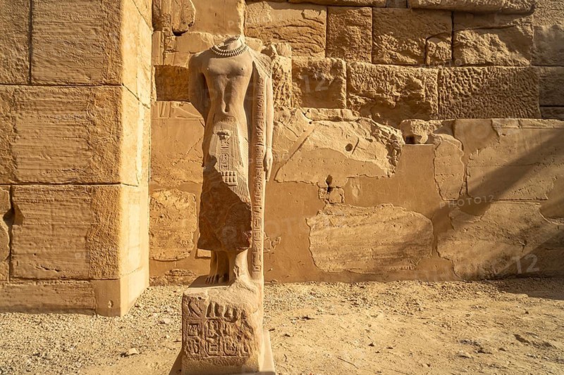 Statue without head in Karnak Temple in Karnak near Luxor, Egypt