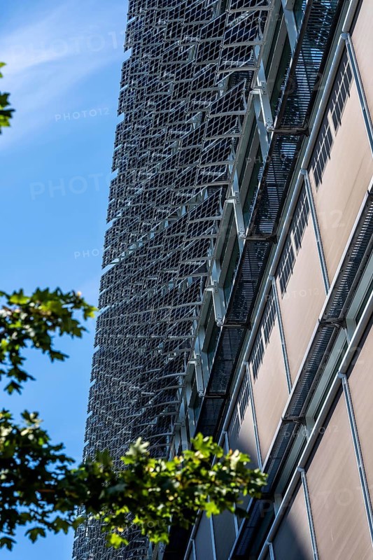 The FLOAT office building in Düsseldorf's media harbor, on Holzstraße, almost 200 meters long façade with movable photovoltaic slats, which on the one hand produce electricity and serve as sun protection for the building, and act as a design element, North Rhine-Westphalia, Germany