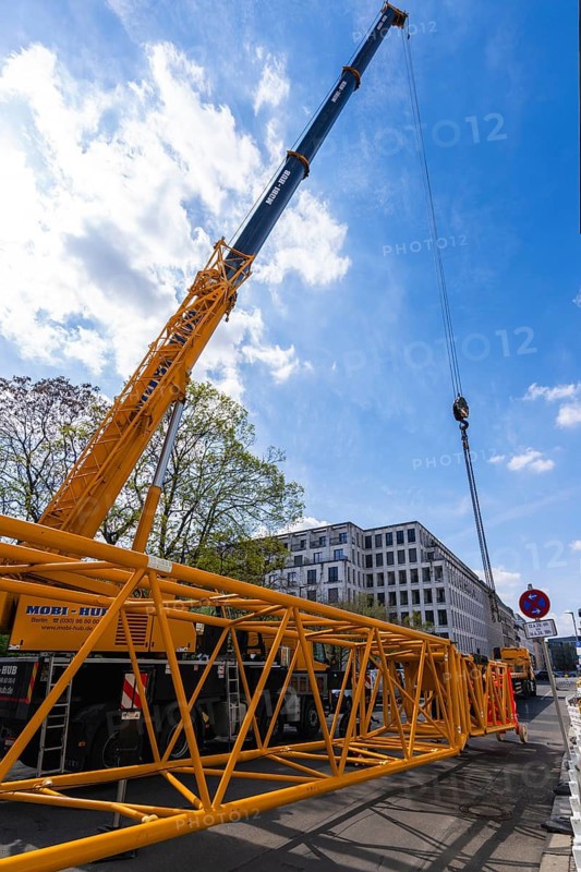 Mobi Hub, heavy construction machine with special technology setting up a crane in the narrow Schumannstraße at Agries Sorma Park, Berlin, Germany