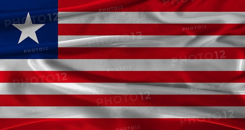 Flag of Liberia with fabric textured background. Close up of National flag of Liberia with realistic texture