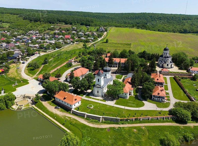 Aerial view of monastery ensemble with orthodox churches and red roofs in a green landscape, aerial view, Capriana monastery, Capriana, Stra?eni district, Straseni, Republic of Moldova, Moldova