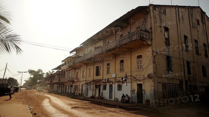 Old multi-storey building on a quiet street in Bissau, Guinea-Bissau