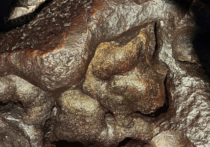 Shiny surface of an iron meteorite, exhibit was found in 1910 in South Africa, German Mining Museum, Bochum, North Rhine-Westphalia, Germany
