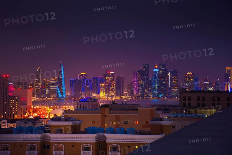 Doha, Qatar - january 8th, 2026: residential area and Doha business hub skyline at night. Iconic illuminated skyscrapers business district luxury middle east gulf colorful night architecture