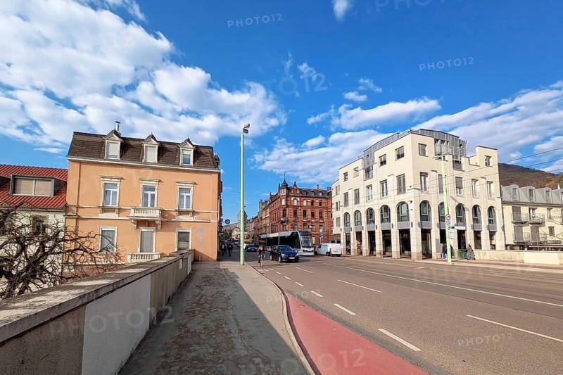 Heidelberg, Germany - 19th March 2026: Heidelberg, Germany - 19th March 2026: Historic commercial and residential building at Brückenstraße 1 in Heidelberg Germany with shops and services at street level. Urban architecture and city life