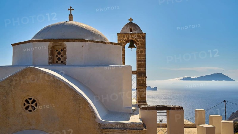 Panagia of Thalassitra church, Panagia Thalassitra, close-up of a Greek church with dome and bell tower, sea in the background, Plaka, capital on Milos, island of Milos, volcanic island, Cyclades, Greek islands, Greece