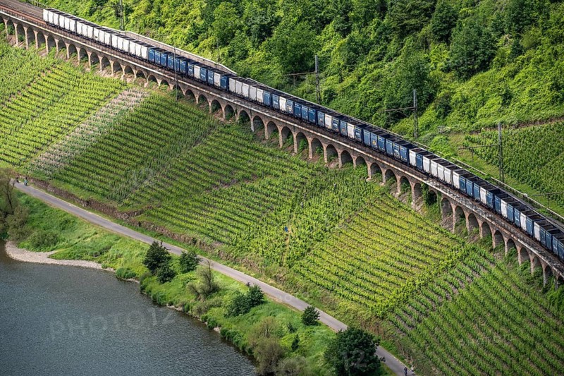The 786 meter long railway hangviaduct, longest in Germany, freight train, near the wine town of Pünderich, in the Cochem-Zell district, on the Moselle, Rhineland-Palatinate, Germany