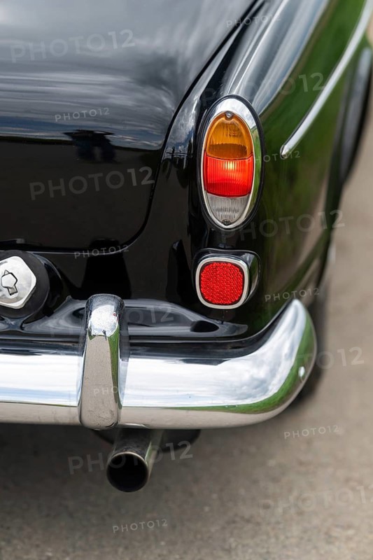 Right rear light and chrome bumper, vintage car, black Volvo Amazon, medium class car from Swedish car manufacturer Volvo, built in 1968