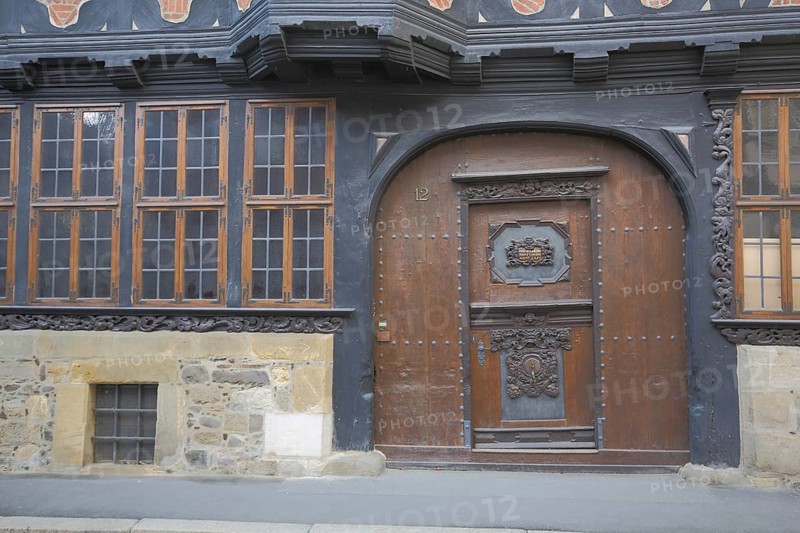 Gate with front door from Siemenshaus built 14th century, brown half-timbered house with decorations, Renaissance, Goslar, Harz, Lower Saxony, Germany