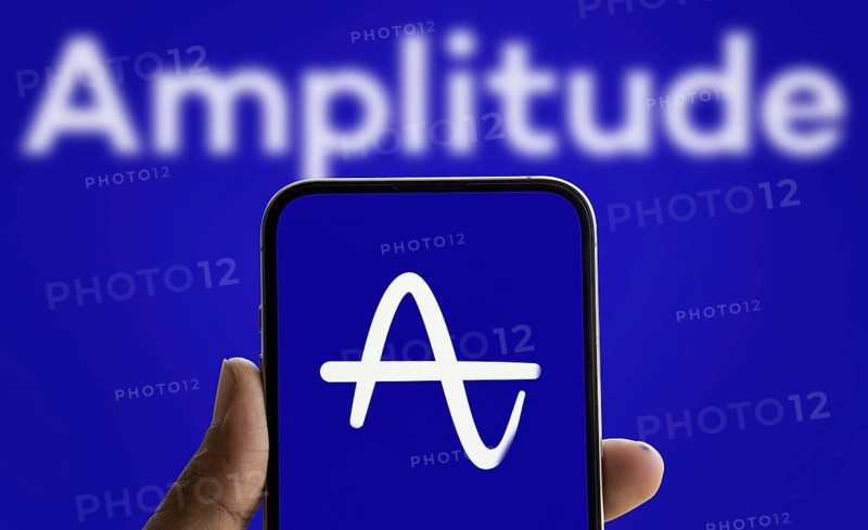 Amplitude logo is displayed on smartphone. Amplitude, Inc. is an American publicly trading company