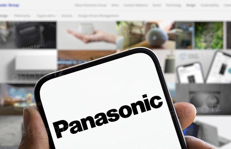 Panasonic logo is displayed on smartphone. Panasonic Holdings Corporation is a Japanese multinational electronics company.
