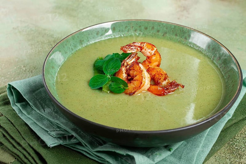 Pea cream soup, with shrimp, green soup, homemade, top view, no people