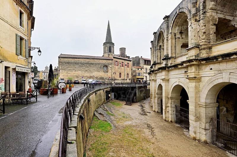 Left Ecole Saint-Charles, right Roman Amphitheatre, Arles, southern France, France