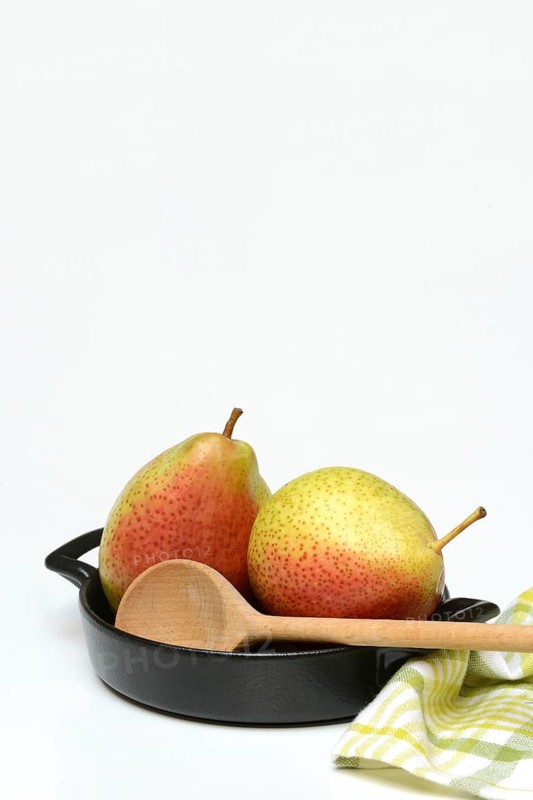 Pears in pot with cooking spoon, symbolic picture
