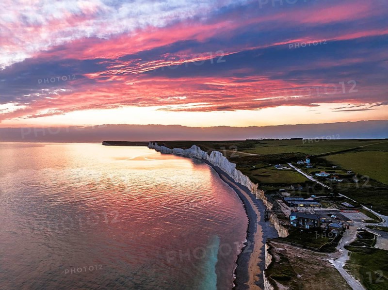 Sunset over Seven Sisters Cliffs from a drone, English Channel, East Sussex, South-east England