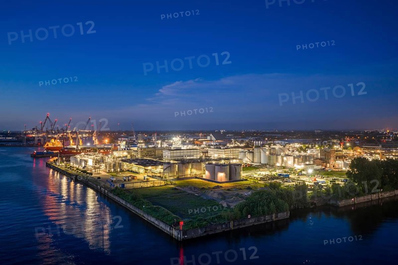 Aerial view of Steinwerder industrial area at blue hour on the Elbe, Hamburg, Germany