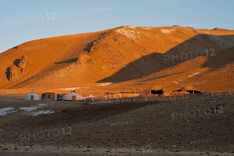 Yurt camp of Mongolian families with yurts, gers, and shelters for cattle, landscape in winter at minus 30 degrees Celsius, Khövsgöl province, Khovsgol, Mongolia