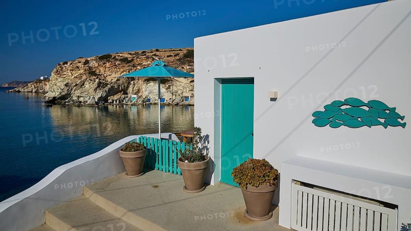 Terrace with green railing and sea view on rocky coast, Syrmata, boat garages, boathouse, boathouses, beach house, Goupa, Goypa, Goupa Kara, Kimolos, Cyclades, Greek Islands, Greece