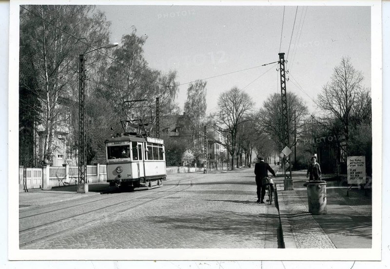 Nordhausen, Harz, Oberstadt, Old tram runs on a quiet city street surrounded by trees, GDR, May 1965