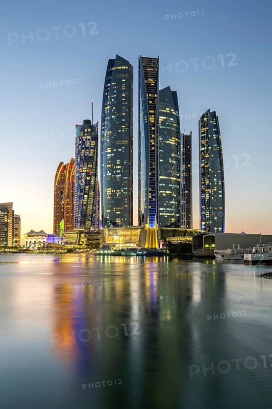 Abu Dhabi Skyline Etihad Towers skyscrapers at night in Abu Dhabi, United Arab Emirates