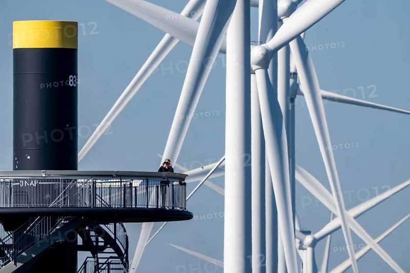 Viewing platform at Landtong Rozenburg wind farm, Noordzeeweg, Paal 83 watchtower 22 meters high, behind it 11 Vestas wind turbines, with an output of 34 MW and an annual result of 117 gigawatts, which corresponds to the consumption of approximately 43, 000 households, on a promontory on Nieuwe Waterweg, at Europoort harbour, hub height 130 meters, rotor diameter 26 meters, near Rotterdam, the Netherlands