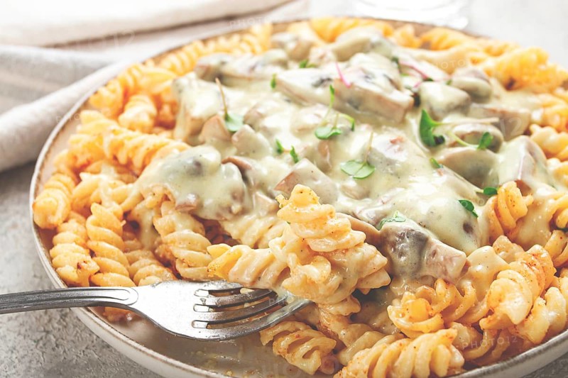 Fusilli pasta, with champignons, in creamy garlic sauce, with herbs and spices, sauce, no people