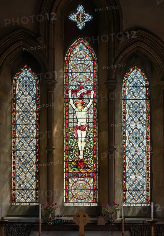 Stained glass east window depicting Crucifixion by Heaton, Butler and Bayne c 1870, Debenham church, Suffolk, England, UK