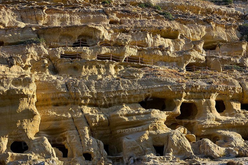 Neolithic caves, former hippie paradise, close-up of an eroded rock wall with several small caves, Matala, south coast, Crete, Greek Islands, Greece