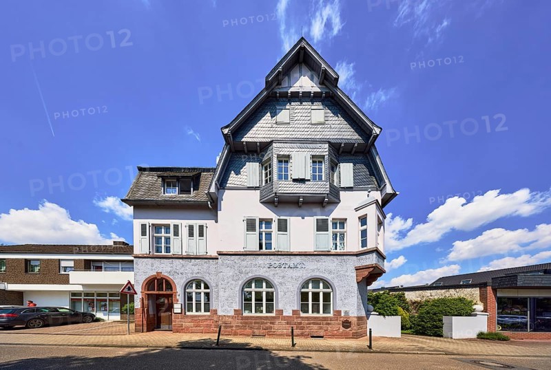 Historic post office, building, barrier bollard, sidewalk, street, blue sky, cumulus clouds, Friedensplatz, Wachtendonk, Kleve District, North Rhine-Westphalia, Germany