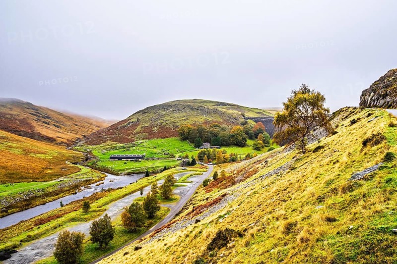 Autumn colors over Claerwen Dam, Claerwen Valley, Elan Valley Reservoir, Rhayader, Powys, Wales, UK