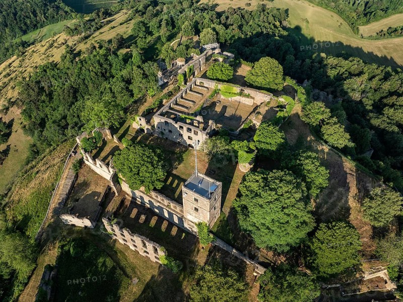 Aerial view, top-down view of the Hohentwiel volcanic cone with Germany's largest fortress ruin, in the morning sun, a tourist attraction in the Lake Constance region, Hegau, Konstanz district, Baden-Württemberg, Germany
