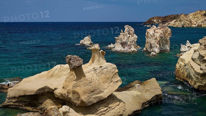 Dramatic rock formations on the edge of the deep blue ocean, Aspragremna, White Cliffs, Mavorspilia Beach, Kimolos Island, Kimolos, Cyclades, Greek Islands, Greece