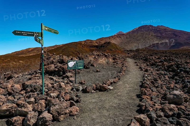 Guia de Isora, El Teide National Park, Tenerife, Canary Islands, Spain - Mirador de Samara, volcanic hiking trail around the volcano de la Botija in the volcanic area of the Parque National del Teide. In the back is the mountain peak of El Teide