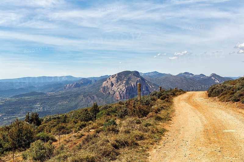 Dirt road, hiking trail to Mirador de los Buitres, mountain landscape near Huesca, Aragon, Pyrenees, Spain