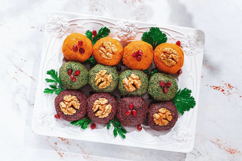 Assortment of Pkhali, pumpkin, spinach and beetroot, Georgian dish, on a white plate, appetizer with nuts and spices, no people, homemade