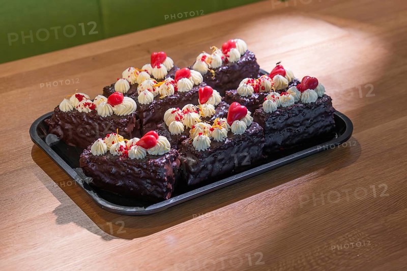 A tray of decorative chocolate chips with cream and cherries, Café Kuh, Deckenpfronn, Germany