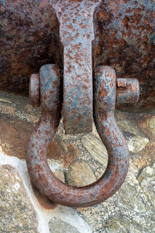 Rusted metal fastener, old shackle bolt, metal shackle with severe corrosion and outdoor surface structure