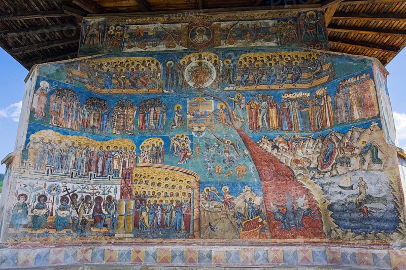 Detailed frescoes with saints and iconic scenes on a church wall, exterior view, Saint George Monastery, Voronet Monastery, Voronet Monastery, UNESCO World Heritage Site, Suceava County, Bukovina Region, Moldova, Romania