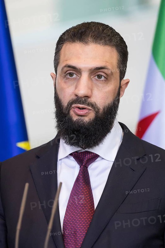 Ahmed al-Sharaa (President of the Syrian Arab Republic) at a joint press conference with Friedrich Merz (Chancellor of the Federal Republic of Germany, CDU) after a one-on-one meeting at the Federal Chancellery, Berlin, 30 March 2026