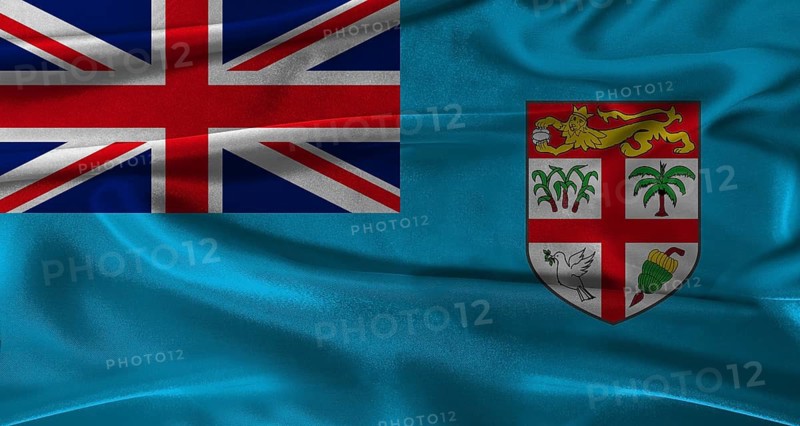 Flag of Fiji with fabric textured background. Close up of National flag of Fiji with realistic texture