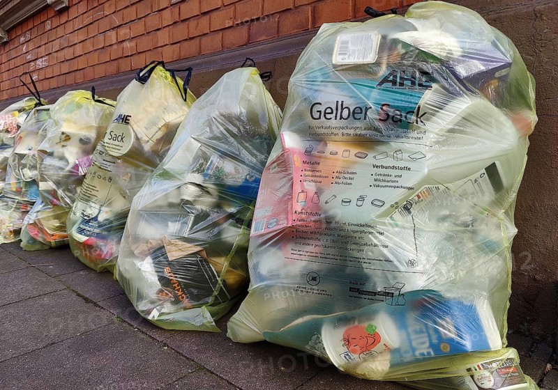 Several yellow bags leaning against a wall, Witten, Ruhr region, North Rhine-Westphalia, Germany