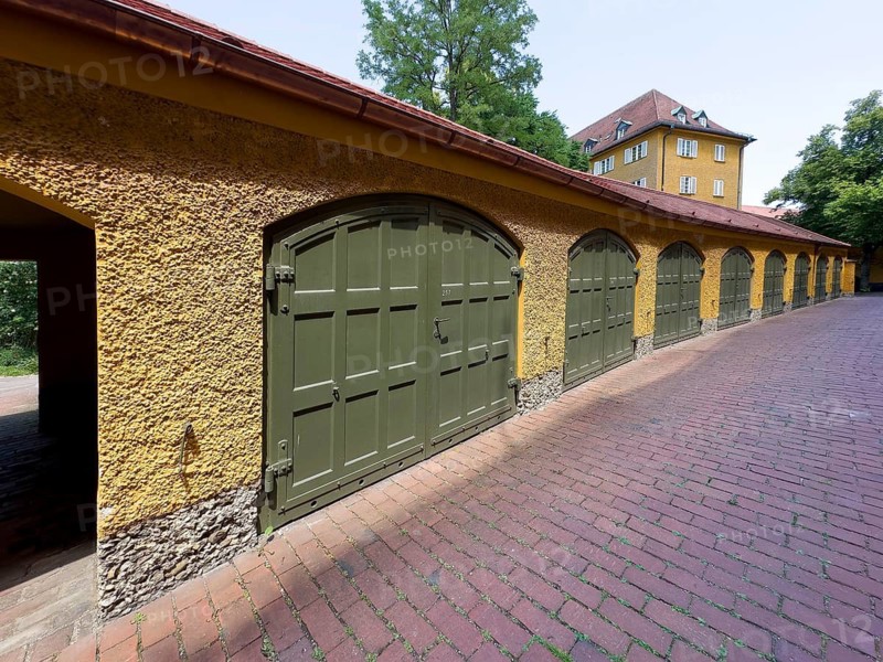 Yellow residential buildings, garages, borstei, heritage-protected residential development, Munich, Bavaria, Germany