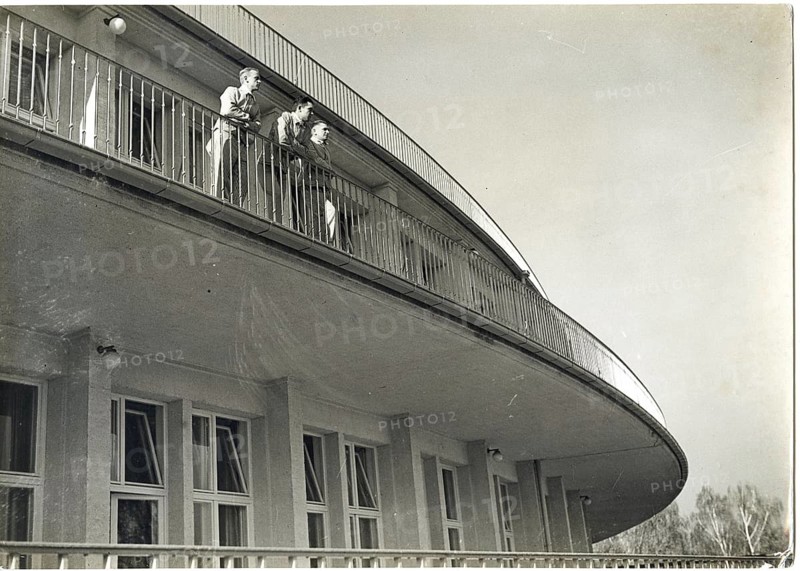 Döberitz, Elstal, Olympic Village, Olympics, Berlin, 1936, Dining House of Nations, Architecture, Werner March, Walter March, Hospital, Two people standing on a curved balcony of a modern building looking into the distance, Albert Weinsheimer
