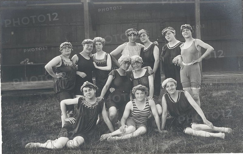 Bathing establishment, woman's bath, bathing, swimwear, woman, leisure, fun, summer, group of woman in bathing suits posing laughing in a meadow, around 1916