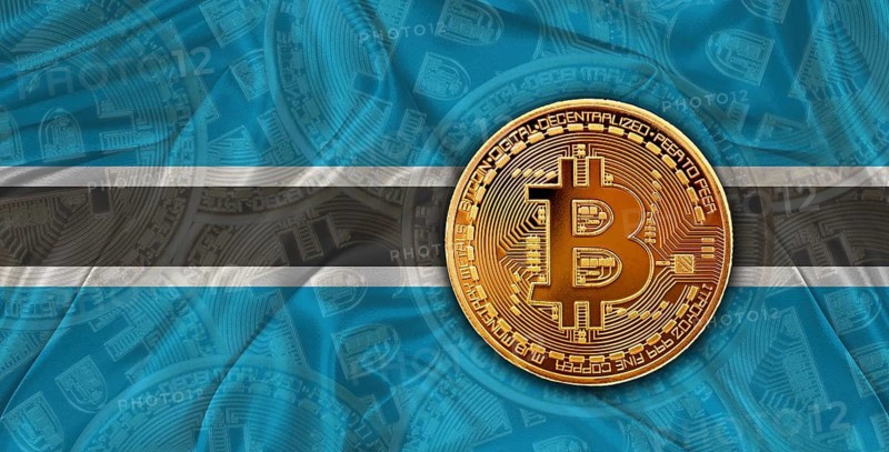 Investors in Blockchain Technology with Botswana flag background. Bitcoin cryptocurrency with Botswanan flag